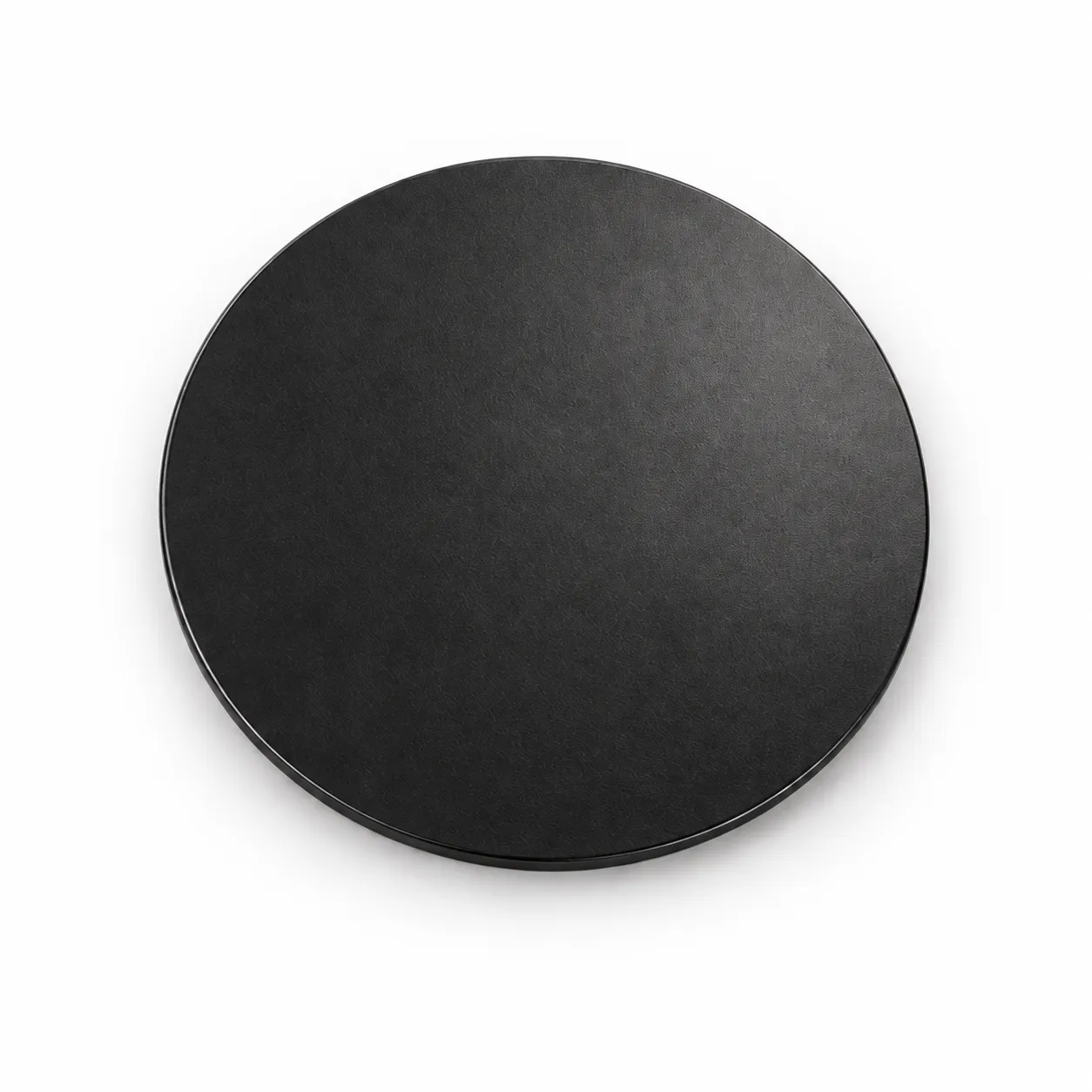 Round coaster with a matte black appearance